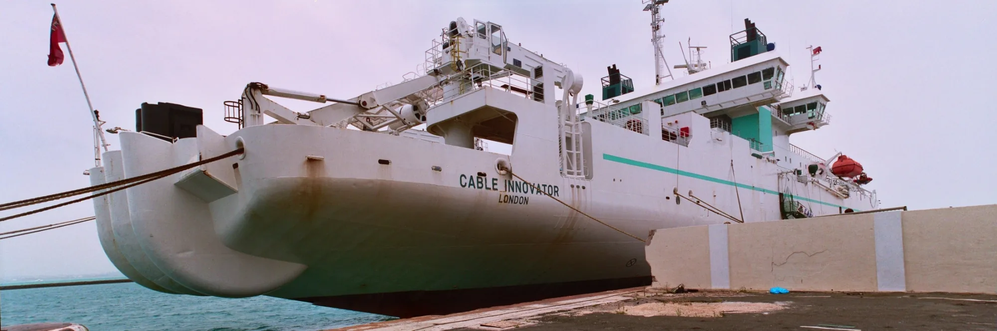 Cable Innovator, a ship built to lay and repair undersea cable, docked in Bermuda. Photo: derlandsknecht, CC BY-SA 2.0.